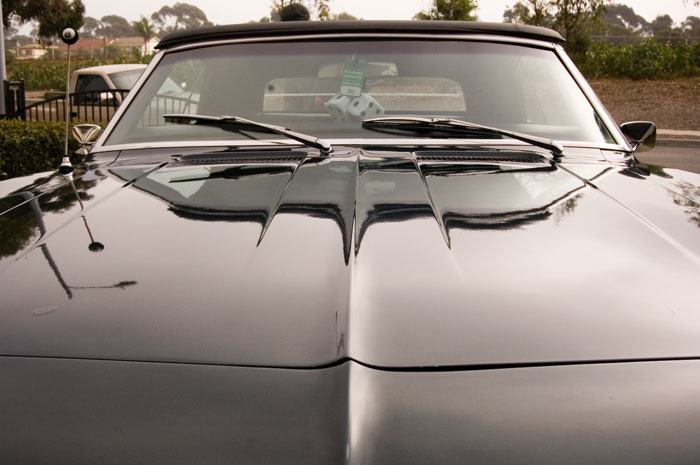 1968 Camaro after paint correction — mirror-perfect black paint