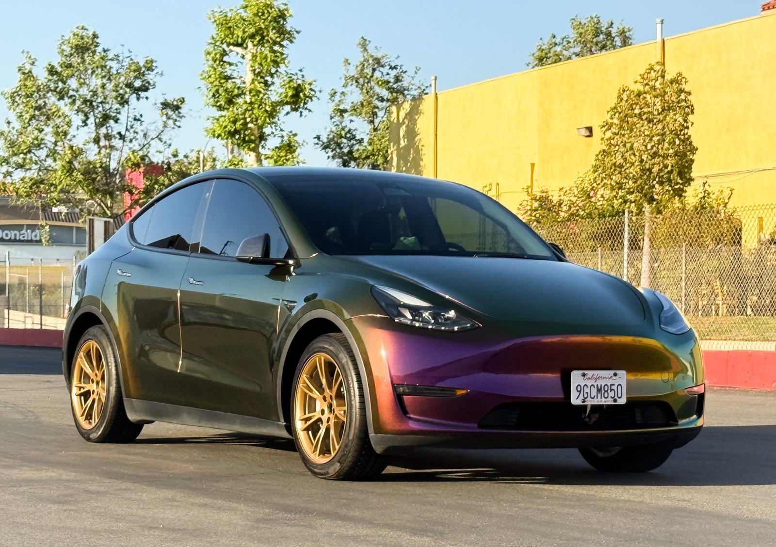 ShowCarPerfection shop car — Tesla Model Y, chameleon PPF with bronze hyper-dipped wheels
