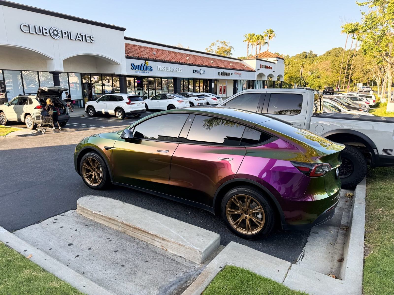 Shop Car — OEM hub caps removed, rear 3/4 view