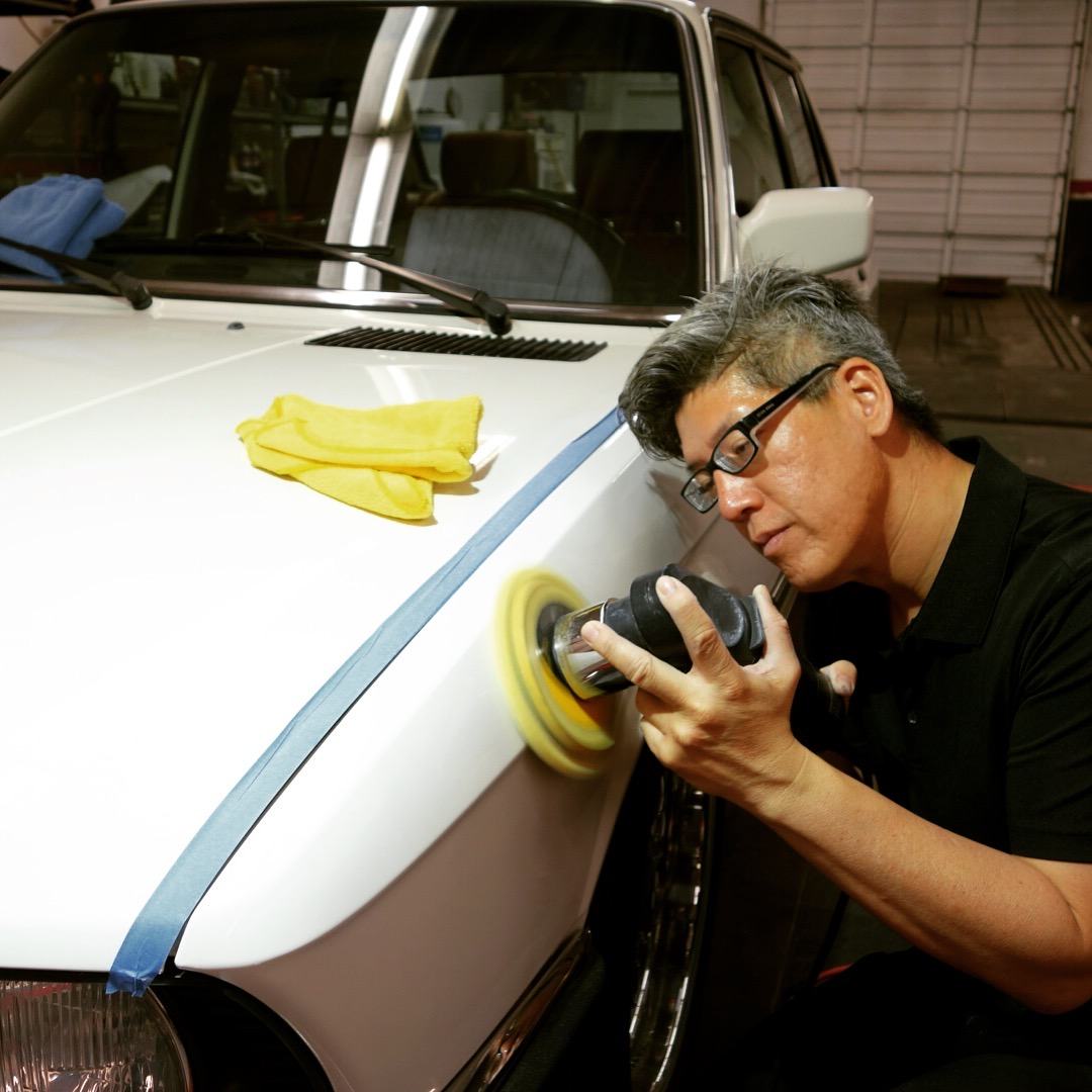 Paint correction under controlled lighting — the shop at 5548 E La Palma