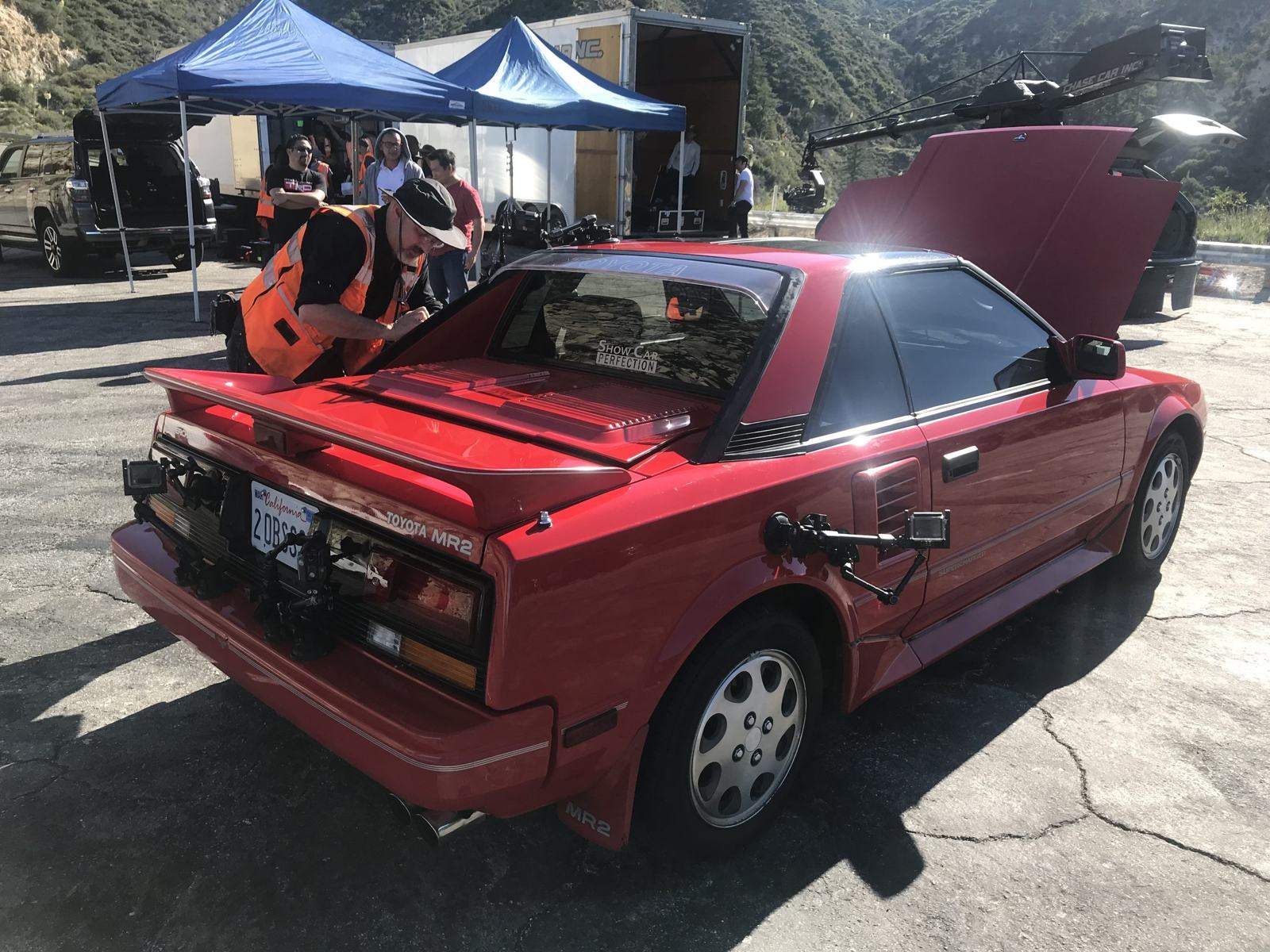 Jay Leno with the MR2 — inspecting the all-original paint