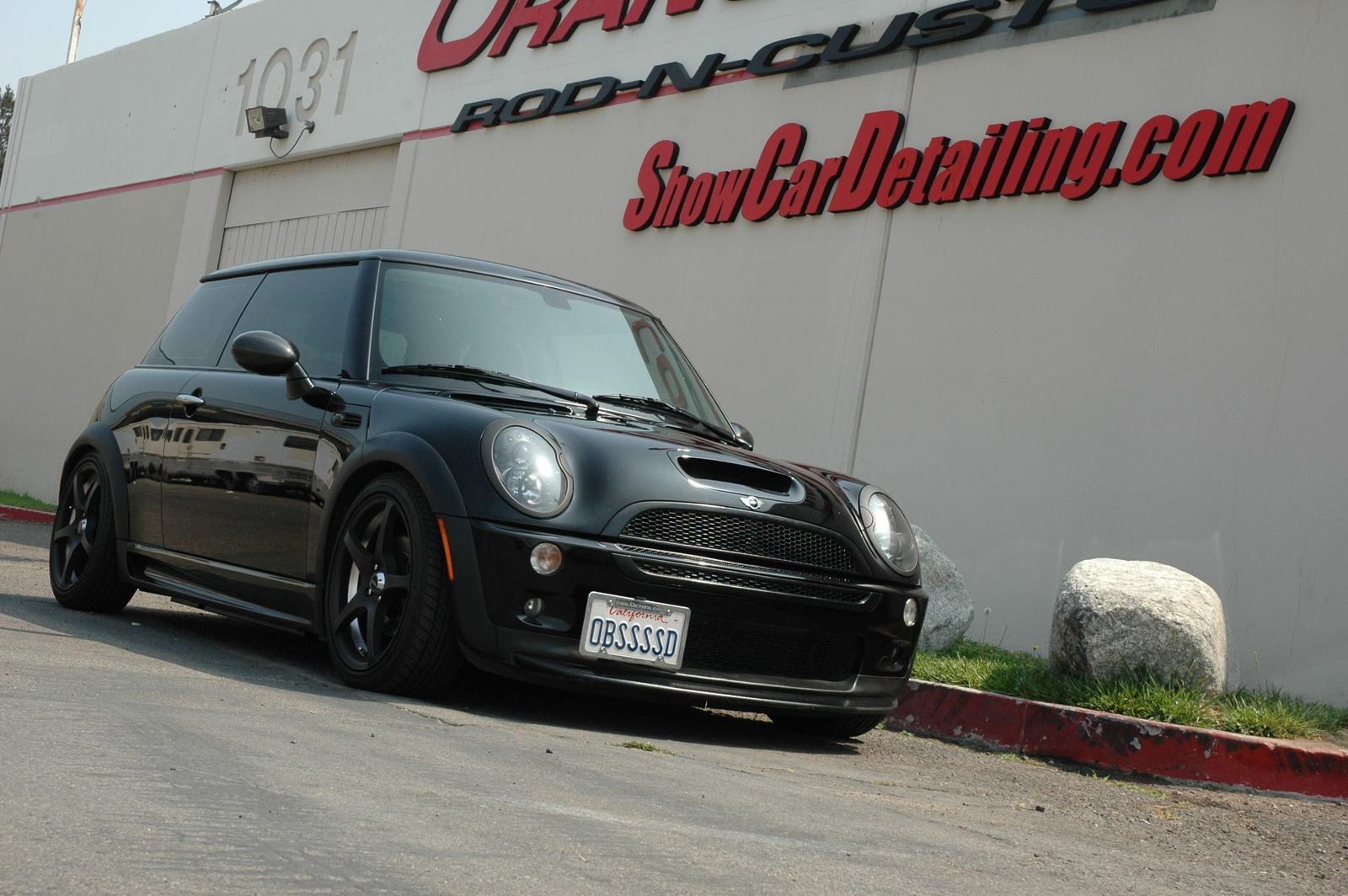 'ShowCarDetailing.com' — painted on the wall of Richard's first rented shop at 1031 Orange Rod-N-Custom. That sign now hangs in the ShowCarPerfection lobby.